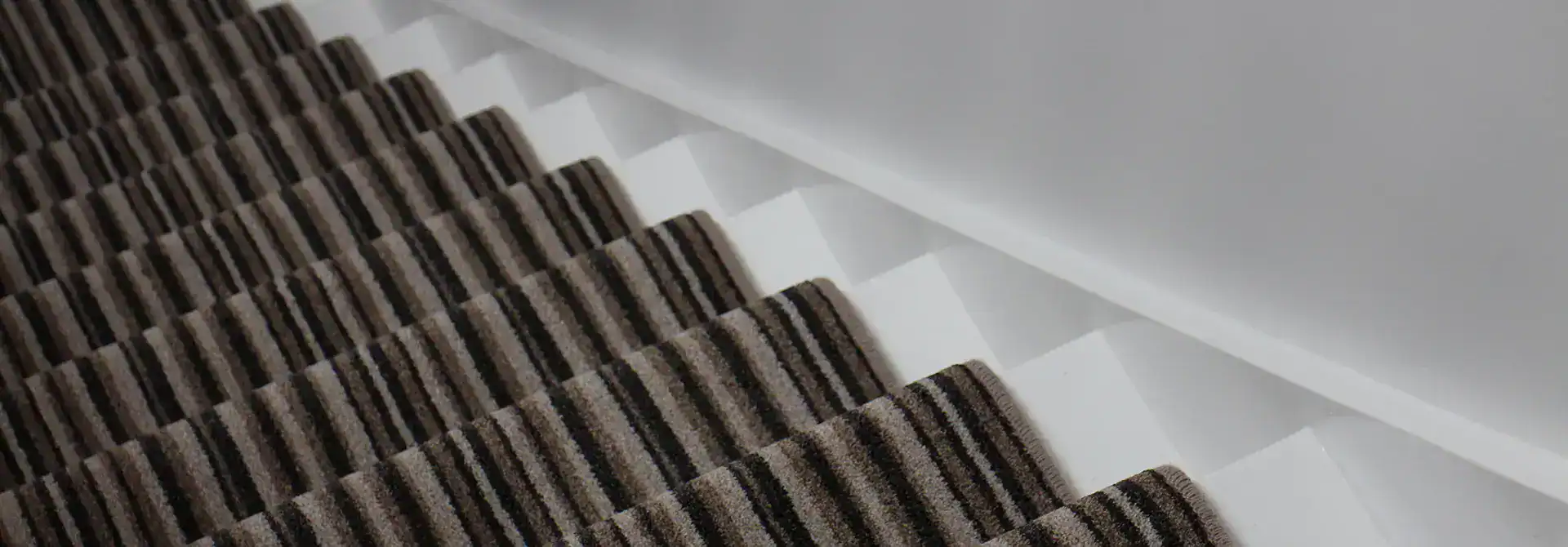 Custom stair runner installation in a Suffolk County home with clean carpet alignment and a polished finished look.